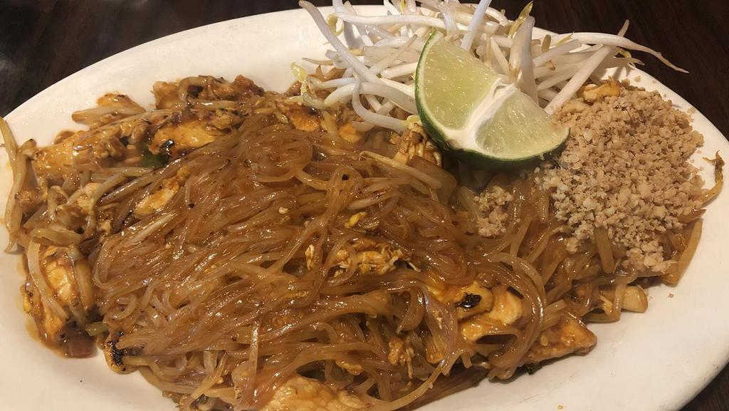 Pad Thai · Stir fried rice noodles with eggs, bean sprouts, green and red onions with a choice of meat and ground peanuts on the side.
