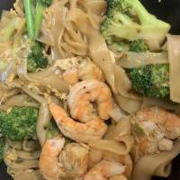 Pad See Ew · Stir fried flat rice noodles with eggs and broccoli in a brown sauce with a choice of meat.
