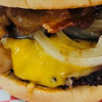 Texas Burger · Cheddar cheese, grilled onions, BBQ sauce, bacon.