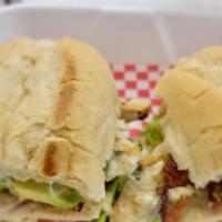 California Chicken Sandwich · Grilled chicken, white cheese, lettuce, tomato, avocado, bacon, mayo. On a hoagie bread.