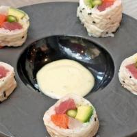 After Rain Roll · Tuna, Salmon, White Fish, Asparagus And Avocado Wrapped In Soy Paperserved With Jalapeno Cre...