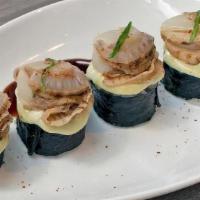 Cooked Creamy Scallop Roll · Spicy Tuna, Asparagus, Tempura Bits, Topped With Creamy Jalapeno And Scallop, Served With Ga...