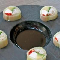 Naked Roll · Lump Crab, Cream Cheese, Fish Roe, Avocado And Scallion Wrapped In Cucumber Topped With Garl...