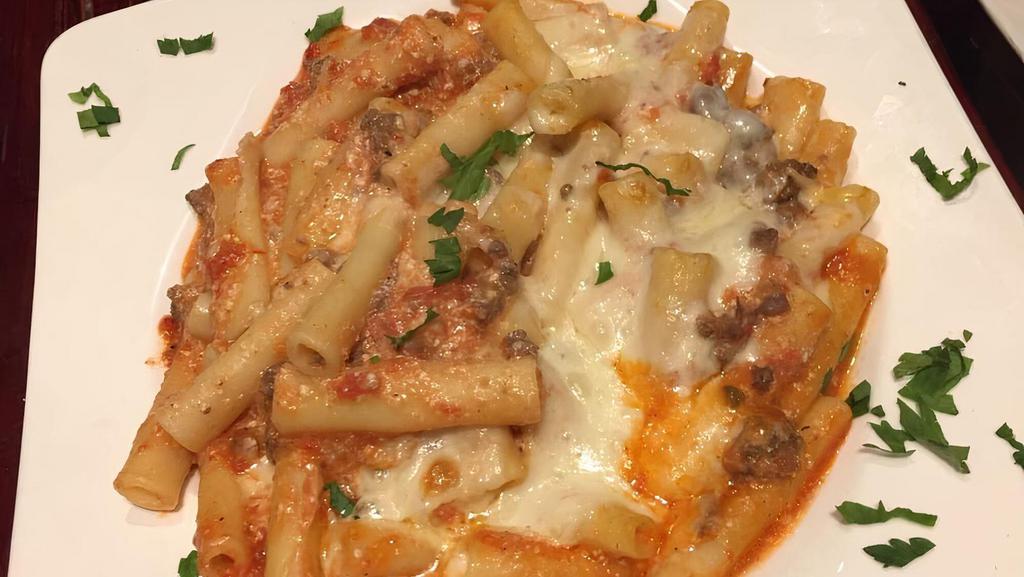 Baked Ziti Bolognese · Baked ziti pasta with marinara sauce rigotta meat sauce topped with mozzarella then baked in the oven
