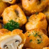 Fried Mushrooms (15Pcs) · Lightly battered fresh mushrooms, fried until golden and crispy. Served with a side of ranch...