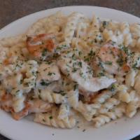 Chicken Alfredo Pasta · Rich Rotini pasta with grilled chicken in a creamy Alfredo sauce and layered with. melted ch...