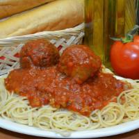 Spaghetti With Meatballs · Classic spaghetti served over meat sauce and delicious Italian meatballs.. Presented with ga...