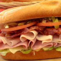 Club Cold Cut Sub · Lettuce, tomatoes, mayonnaise, turkey, ham, and bacon with provolone cheese.