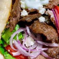 Lamb Gyro · Sliced lamb, beef gyro meat on Gyro bread with homemade gyro cucumber sauce, lettuce, tomato...