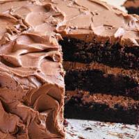 Chocolate Cake · Moist dark chocolate cake layered and topped with rich chocolate ganache frosting.