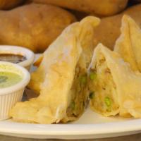 Vegetable Samosa (2 Pcs) · Crispy turnover filled with potatoes and green peas. Served with tamarind or green chutney.