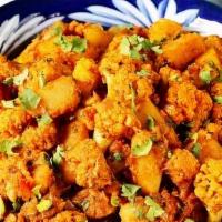 Aloo Gobhi Masala · Spiced Potatoes with Cauliflower. This Aloo Gobi is packed with flavors, super comforting, v...