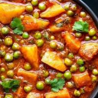 Aloo Matter (Potatoes & Green Peas) · Garden fresh green peas cooked with potatoes in an onion-based sauce. Aloo mutter is a Punja...