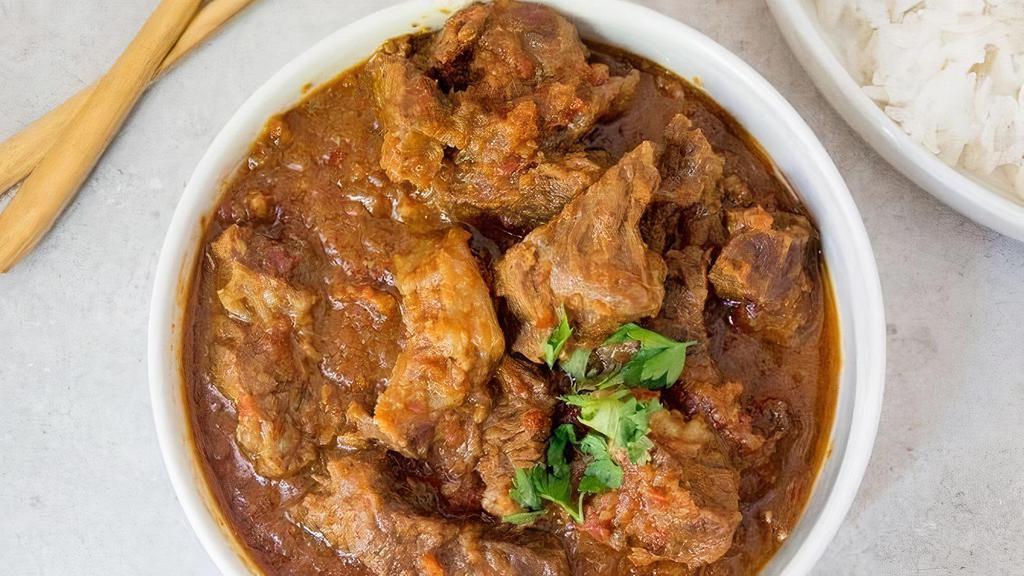 Lamb Curry · This lamb curry is made by slow-cooking lamb.  Lamb meat is made simmered with fragrant of spices, caramelized onions, and Greek yogurt until fork-tender.