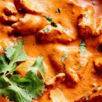 Butter Chicken · Chef's specialty tender chicken cooked in a traditional tomato sauce. Served with basmati ri...