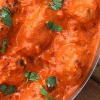Chicken Tikka Masala · A house specialty charbroiled chunks of chicken cooked in chef's secret blend of spices. Ser...