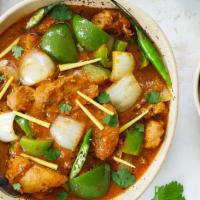Chicken Karahi · Chunks of chicken cooked over high heat with onions, tomatoes, and green peppers. Served wit...