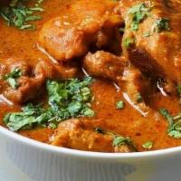 Chicken Curry · Traditional Indian Chicken Curry cooked in an onion-based sauce. Served with basmati rice. C...
