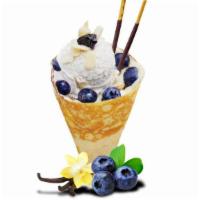 Cheesecake Delight · Included - soft crepes, blueberry, almond, blueberry jam, whipped cream cheese, custard crea...