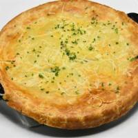 Chicken Pot Pie · Pulled chicken, red potatoes, peas & thyme, topped with a flaky puff pastry. Baked daily.