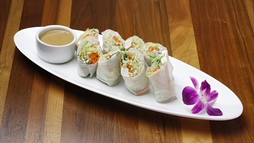 Fresh Spring Rolls · (Vegan, Gluten Free). Lettuce, mint, carrot, cucumber, and cilantro wrapped in soft rice paper with your choices of Tofu or Shrimp. Served with peanut sauce. (4 Rolls)