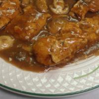 Chicken Marsala · Sauteed seasoned chicken breast and fresh mushrooms in a marsala wine sauce. Served with a s...