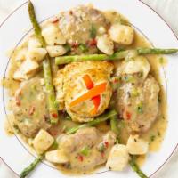 Veal St. Michael · Veal medallions topped with scallops, fresh asparagus and crab imperial in a lemon wine sauc...
