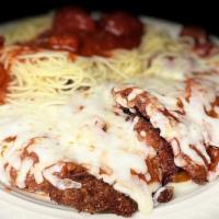 Veal Parmigiana · Tender veal lightly breaded and topped with mozzarella cheese and tomato sauce and baked. Se...