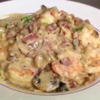 Shrimp Carbonara · Jumbo shrimp with bacon, mushrooms and scallions in a creamy Italian sauce. Served over fres...