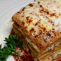 Homemade Lasagna · Italy's favorite! layered pasta sheets with three cheeses, seasoned beef meat sauce and spic...