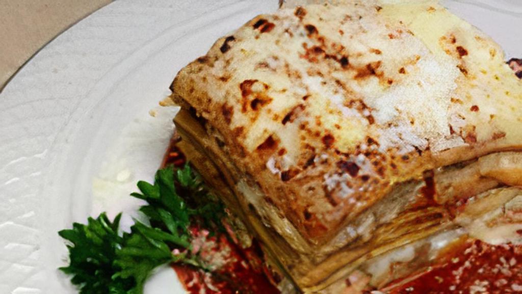 Homemade Lasagna · Italy's favorite! layered pasta sheets with three cheeses, seasoned beef meat sauce and spicy Italian sausage.