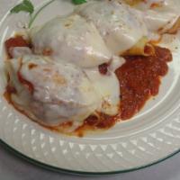 Stuffed Shells · Large pasta shells stuffed with three cheeses, baked in marinara sauce, topped with mozzarel...