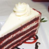 Red Velvet Cake · Four wonderful layers of moist red velvet cake, all sandwiched between and topped with a smo...