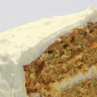 Carrot Cake · Super moist double layered cake with grated carrots, real pineapple, chopped walnuts and hin...
