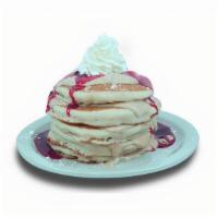 Ny Cheesecake Pancakes · Buttermilk pancakes filled with cream cheese. Topped with strawberry glaze, whipped cream, a...