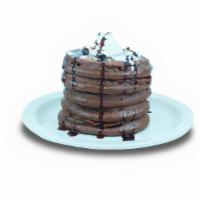 Double Chocolate · Chocolate pancakes filled with chocolate chips. Topped with whipped cream, chocolate chips a...