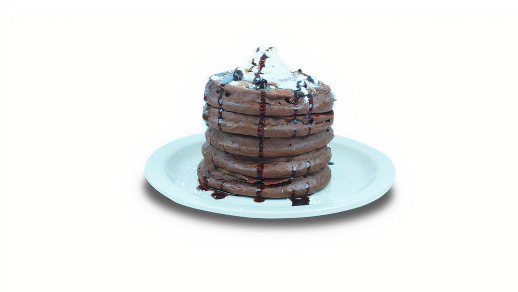 Double Chocolate · Chocolate pancakes filled with chocolate chips. Topped with whipped cream, chocolate chips and drizzle of chocolate syrup.