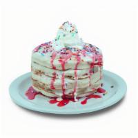 Birthday Pancakes · Buttermilk pancakes filled with rainbow sprinkles. Topped with our special vanilla icing, wh...