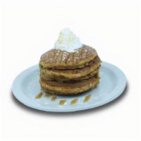 Pumpkin Pancakes · Pumpkin pancakes filled with pumpkin spices. Topped with whipped cream, powdered sugar and d...