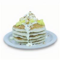 Pina Colada · Buttermilk pancakes filled with pineapple. Topped with our special Pina Colada icing, pineap...