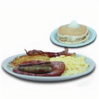 Meat Lovers Plate · Two eggs your way, golden hash browns two bacon strips, two pork sausage links, one slice of...