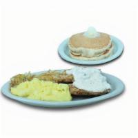 Country Fried Steak Breakfast · Golden-battered beef steak smothered in country gravy. Served with two eggs your way, hash b...