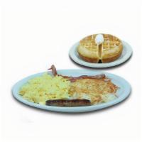 Waffle Combo · A golden-brown belgian waffle. Served with two eggs your way, two bacon strips or two pork s...