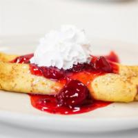 Strawberry Creme Cheese Crepes · Crepes filled with strawberry cream cheese, topped with strawberry glaze and whipped cream.