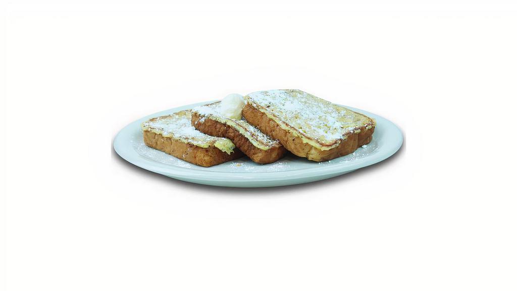 French Toast · French Toast topped with powdered sugar, and butter.
