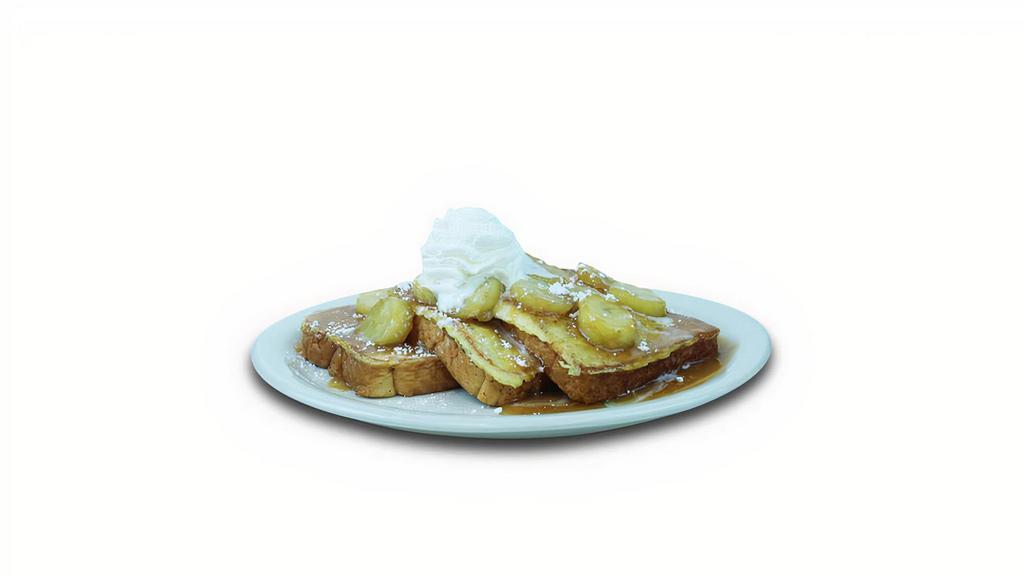 Banana Foster French Toast · French Toast topped with banana slices and whipped cream covered in sweet caramel sauce.
