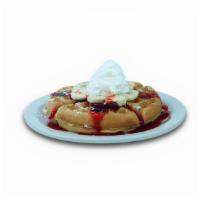 Strawberry Banana Waffle · Belgian waffle topped with powdered sugar, bananas, strawberry glaze, and whipped cream.