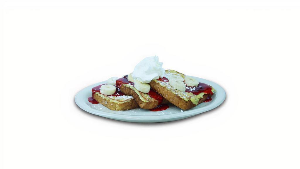 Strawberry Banana French Toast · French toast topped with fresh bananas, strawberry glaze and whipped cream.