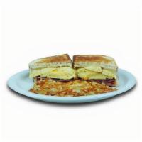 Ham & Egg Melt · Grilled sourdough, eggs, ham, American and Swiss cheeses. 960 calories.