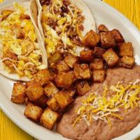 Breakfast Taco Plate · Your choice of two breakfast tacos. Served with Latin-fried potatoes and refried beans.. {GF...
